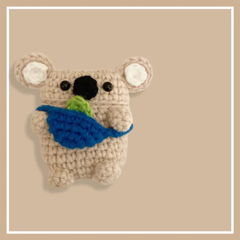 Hand-knitted koala bear backpack design cover for Apple AirPods case.