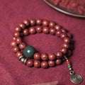 Bodhi seed double circle bracelet with cartoon charms on wrist