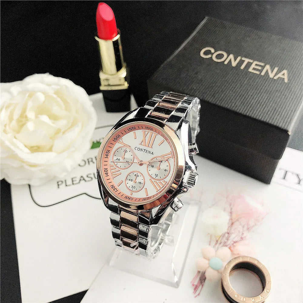 Women's silver rose gold quartz watch with diamond crystal mesh strap and analogue display.