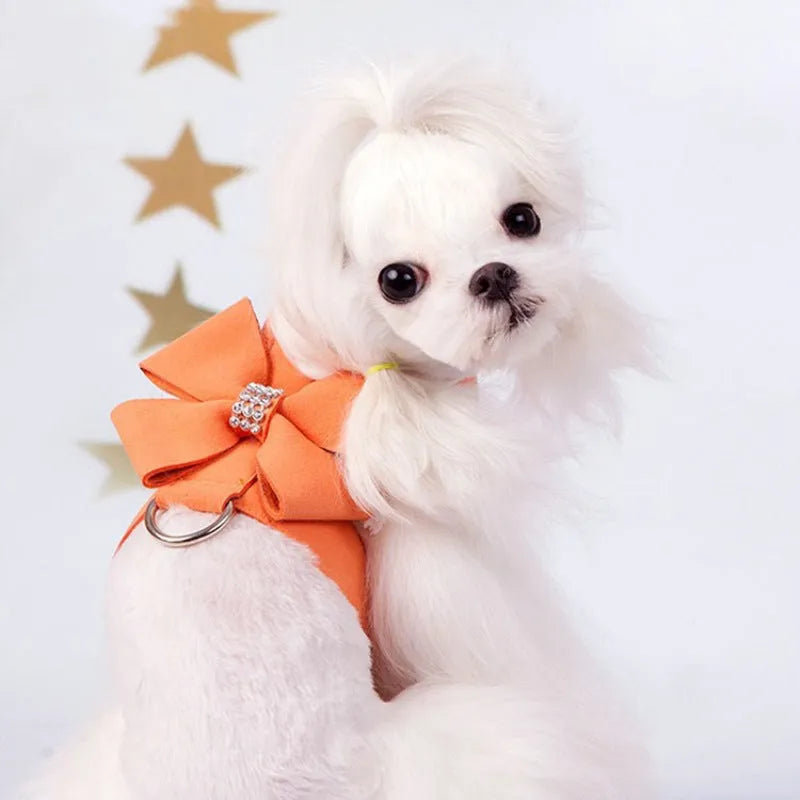 Cute pink puppy harness with a bowknot, made from soft microfiber, shown on a small dog.