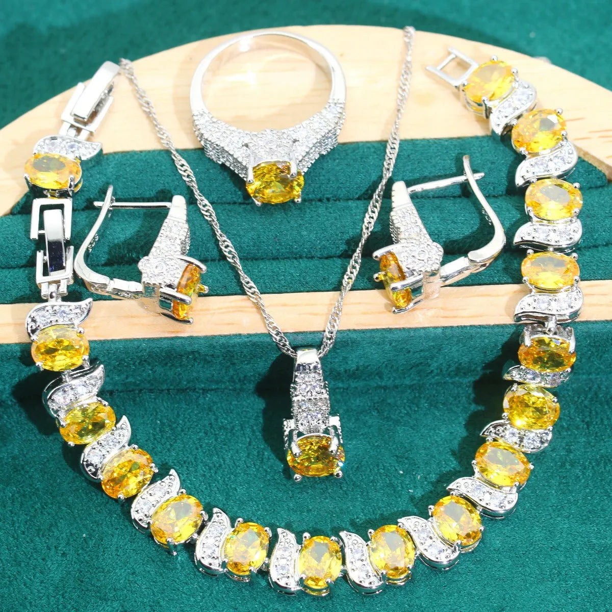 Bridal zircon jewellery four-piece set showing necklace, bracelet, earrings and ring with water wave chain