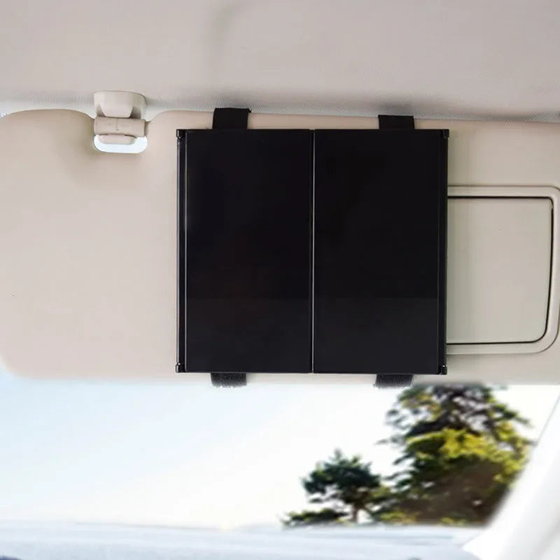 Silver car folding makeup mirror shown closed at 15.5cm and opened to 30.5cm wide.