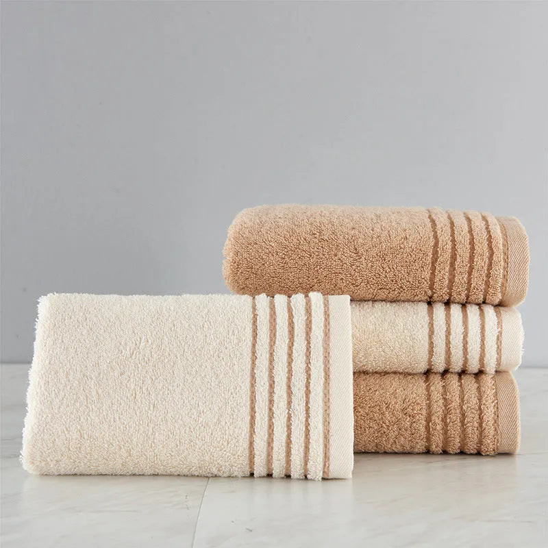 Cotton towel set showing bath, hand and face towels in beige or brown colours