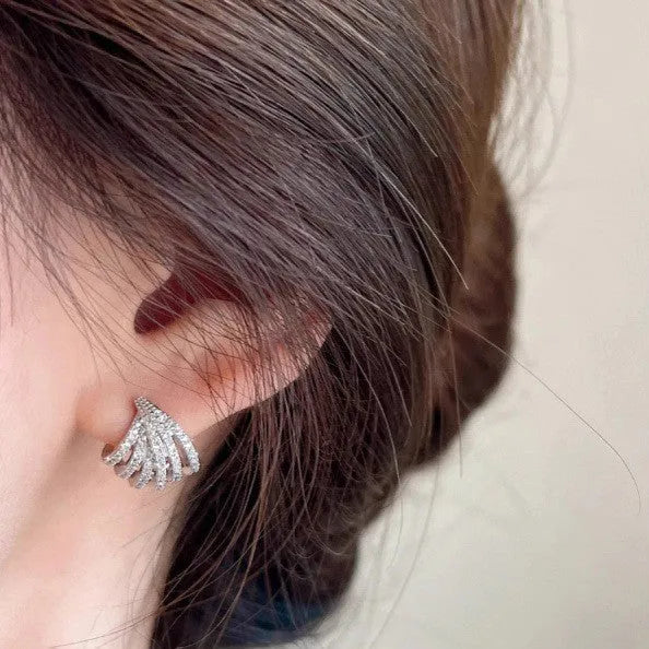 A pair of women's geometric design zircon earrings with a platinum colour electroplated finish.