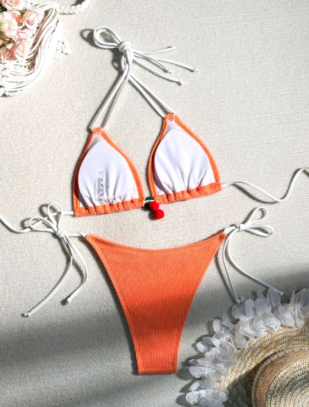 Solid colour nylon bikini briefs swimsuit in briefs style on a mannequin.