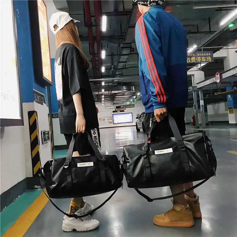 Black fabric portable travel bag shown in large 49cm and small 45cm sizes