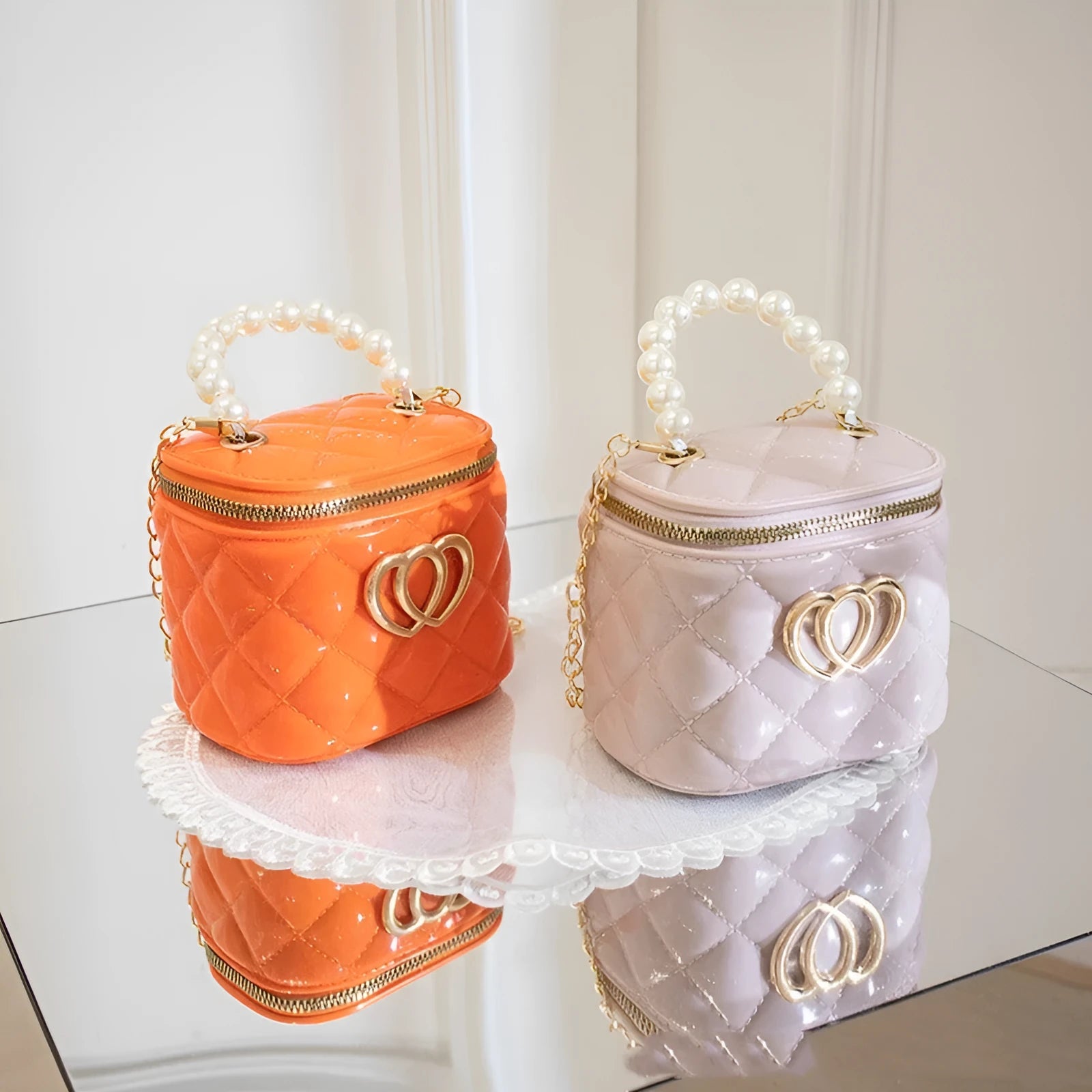 White PVC bucket bag with a red heart pattern, showing its shape and design.