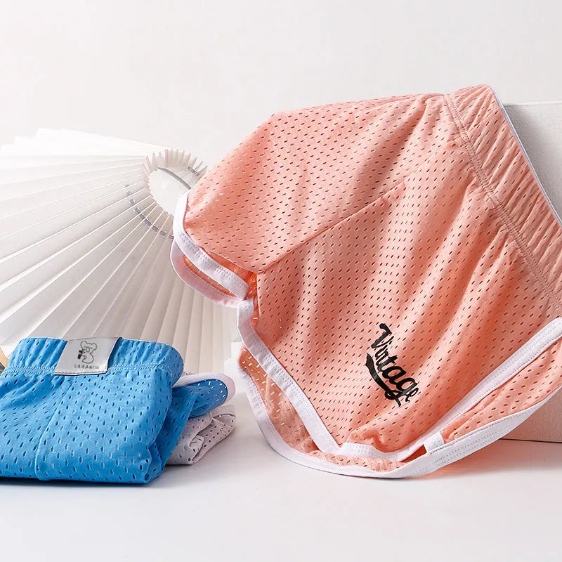 Men's solid colour ice silk boxers in mid waist design, shown in one of six available colours.