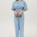 Blue polyester men's two-piece suit with trousers and long-sleeve jacket on hanger
