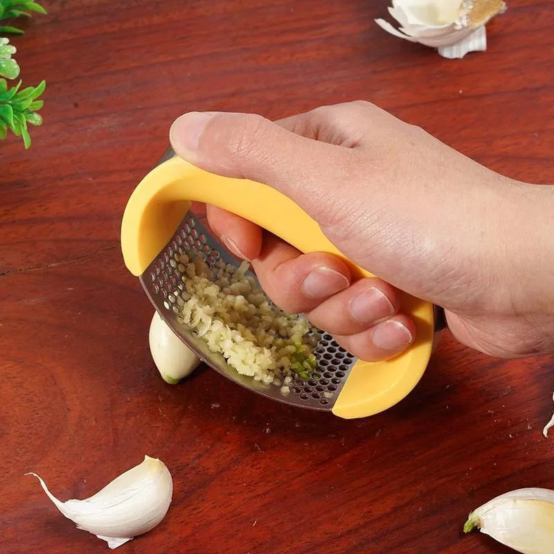 Stainless steel manual garlic press with ergonomic non-slip handle in assorted colours