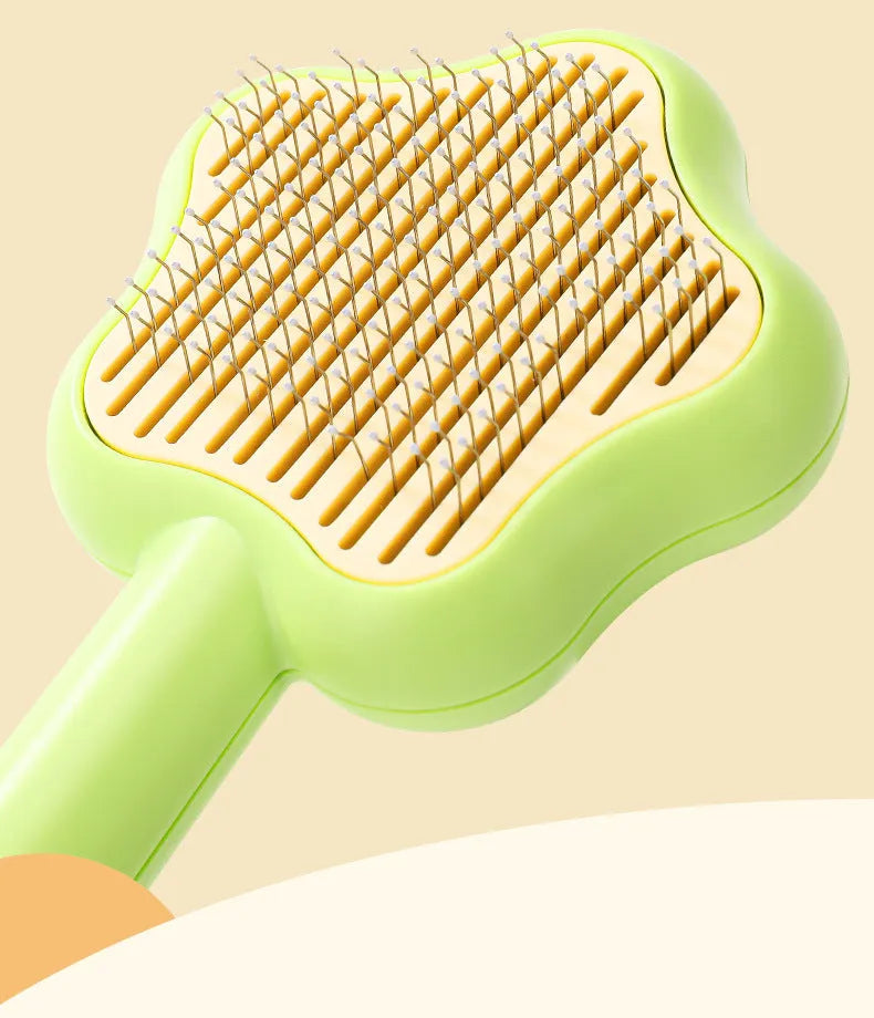Green self-cleaning cat comb with stainless steel needle teeth and 20 cm handle