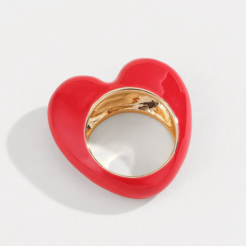 Colourful three-dimensional enamel heart ring on a zinc alloy band.
