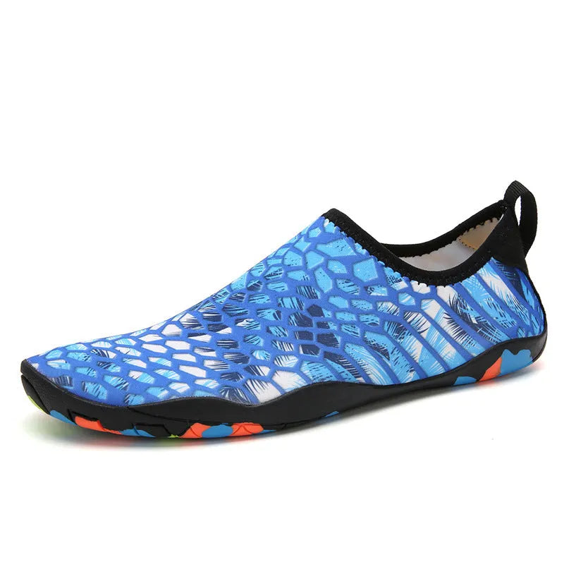 Lycra beach wading shoes with EVA midsole in blue, shown on a sandy shore.