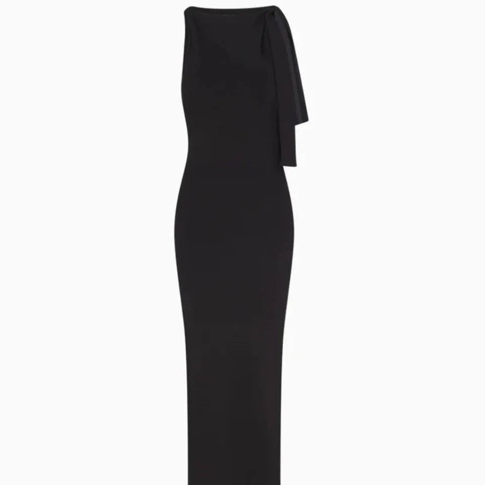White sleeveless sloping shoulder long dress with high waist, hip skirt shape and fold detail in polyester
