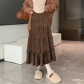 Beige corduroy A-line midi skirt with an elasticated waistband on a hanger.
