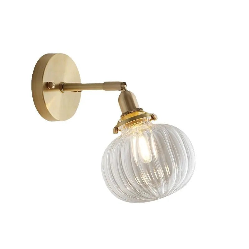 Glass wall lamp with a transparent or blue shade for living room or bedroom.