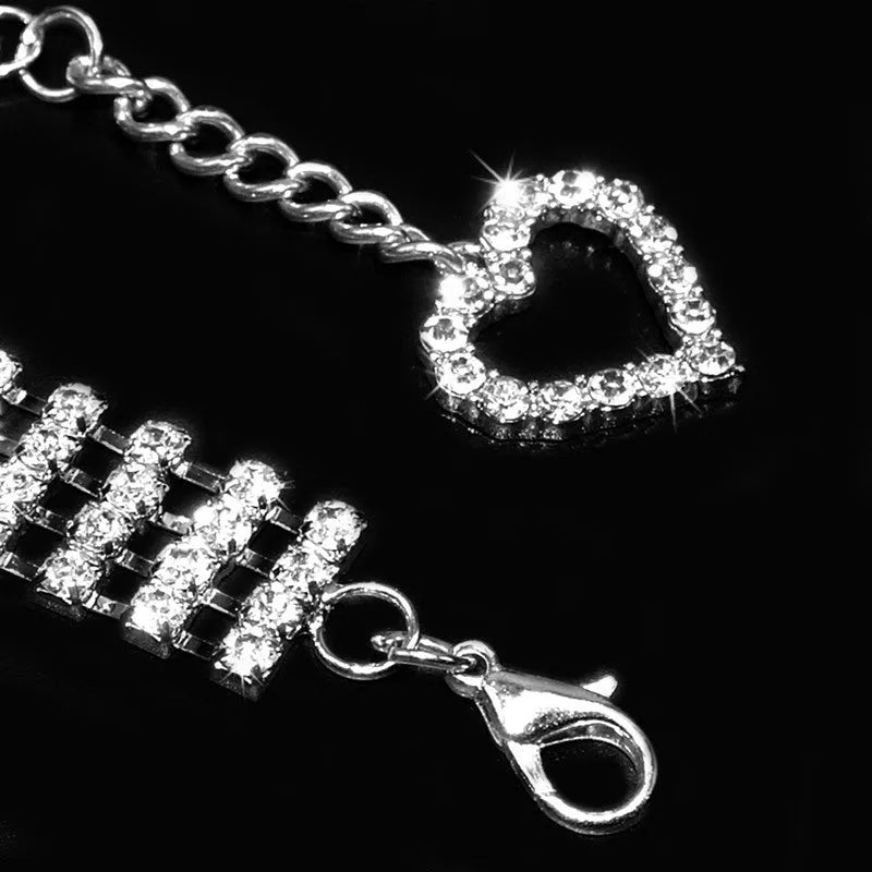 Four-row rhinestone pet collar with heart-shaped chain, silver plated, shown in white, pink, or blue