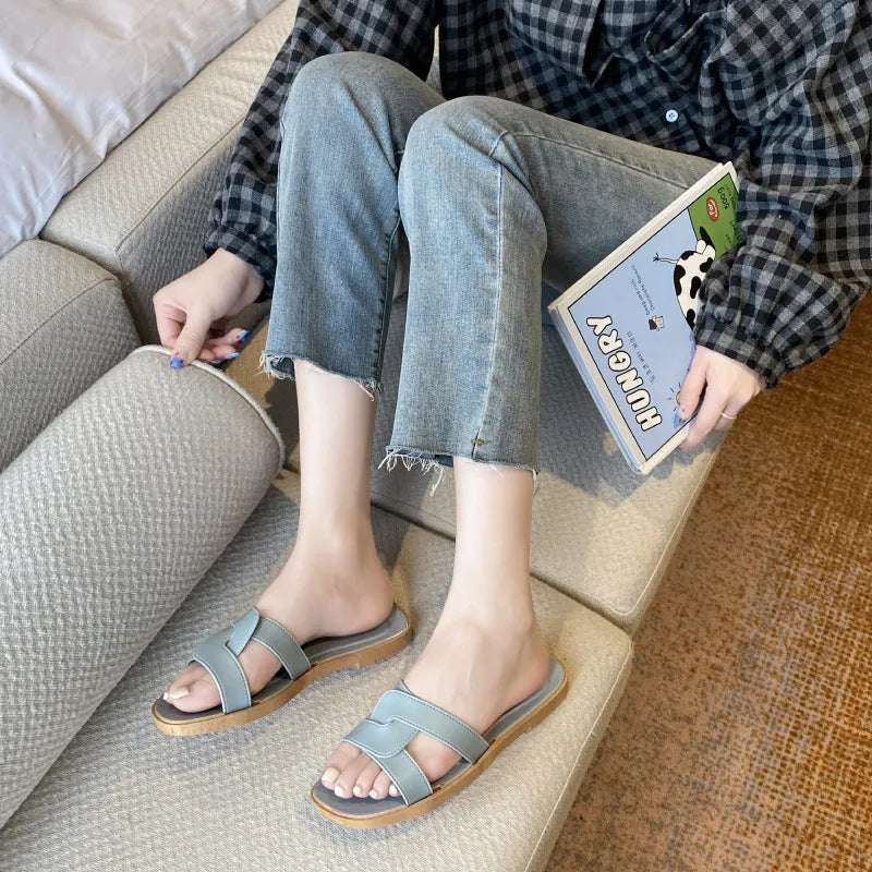 Women's solid-colour cross-strap PVC sandals with a toe-ring design on a non-slip sole.