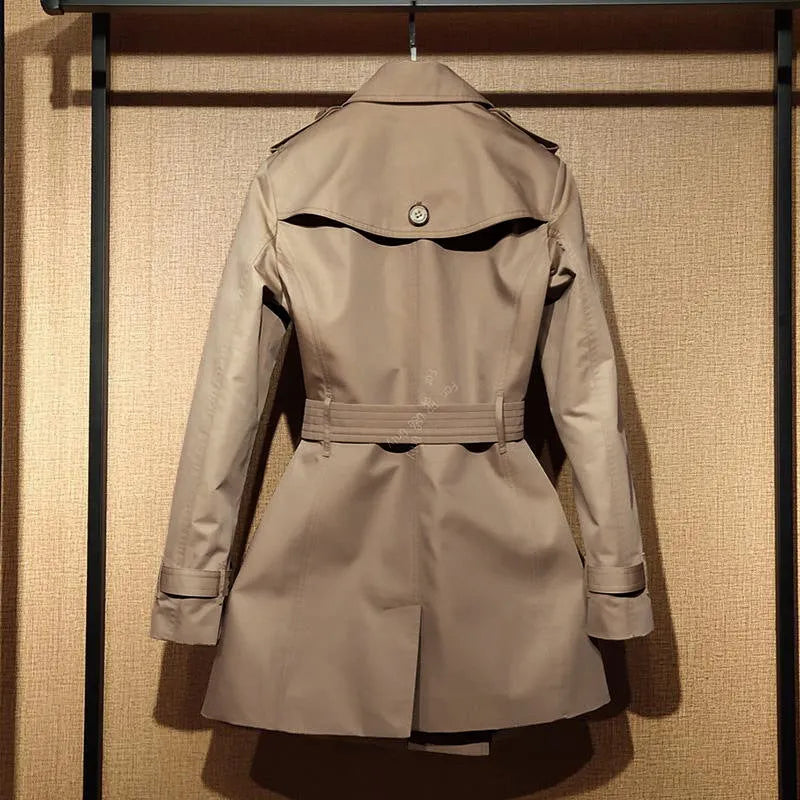 Khaki double-breasted trench coat for women with flight sleeves and button details.