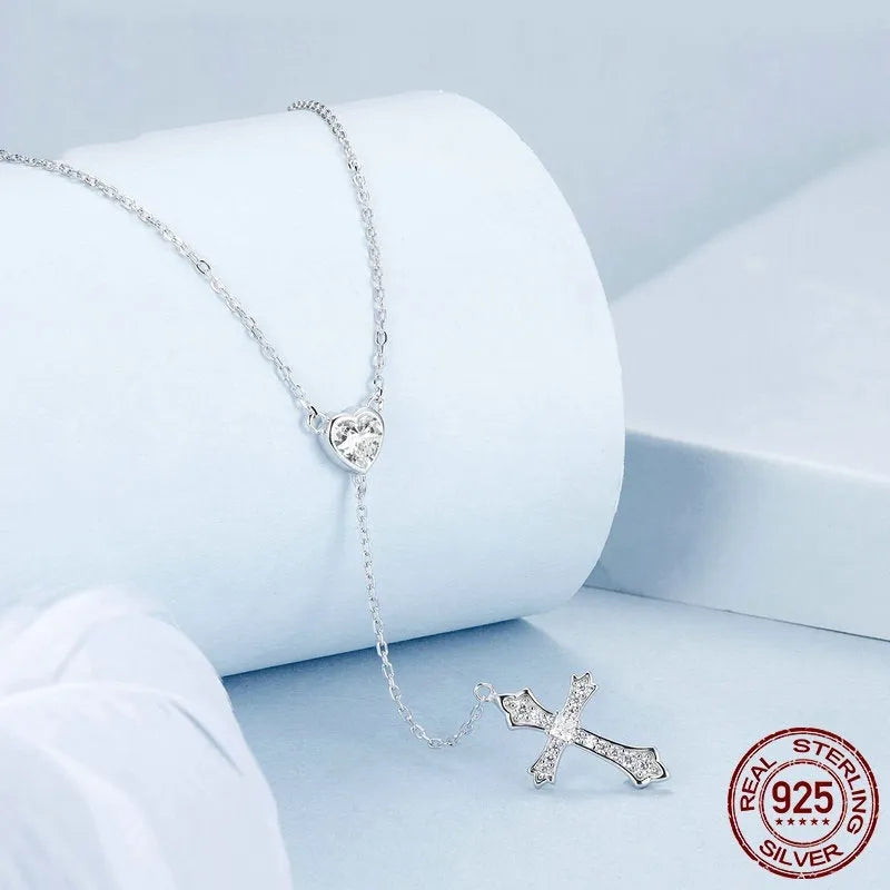 Women's simple V-neck Love cross pendant necklace made from 925 silver on an O-ring chain.