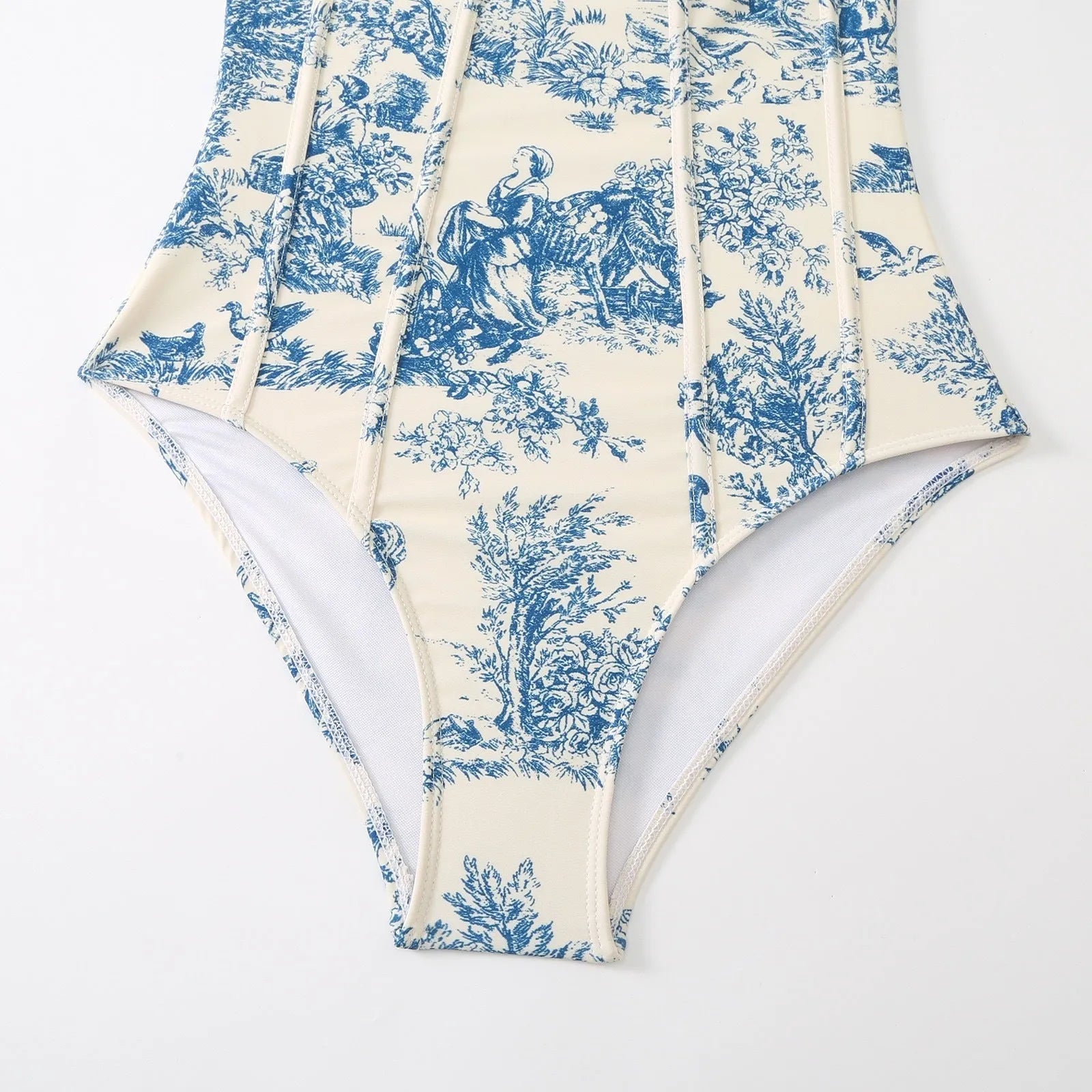 Blue women's one-piece swimsuit with matching gauze skirt set on mannequin