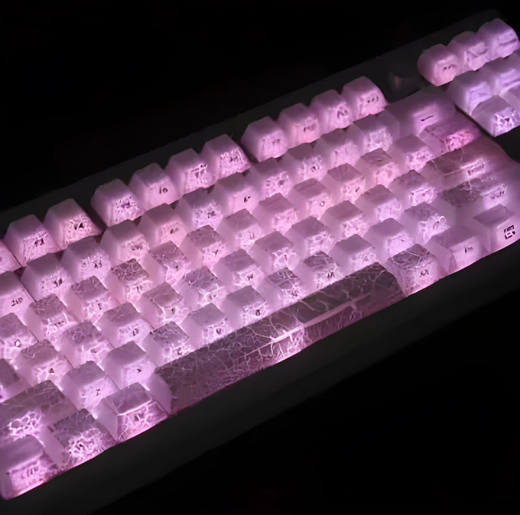 White transparent mechanical keyboard keycap set with side carving details on a black background.