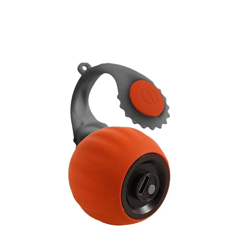Orange and blue silicone gravity-powered cat toy with rolling ball and gun grip attachment options