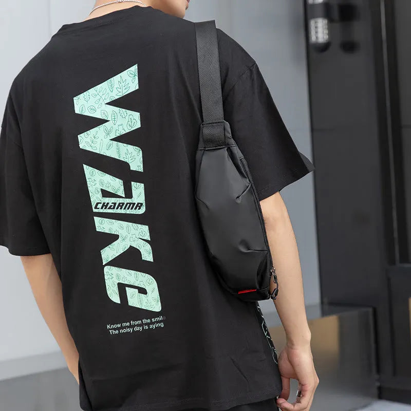 Black Oxford cloth crossbody waist pack with zip closure, shown with internal phone and ID pockets visible.