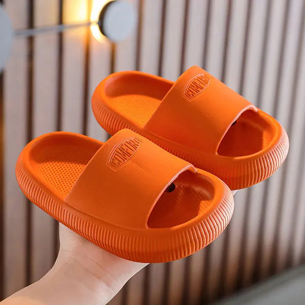 Children's colourful EVA slippers with a non-slip sole on a white background.