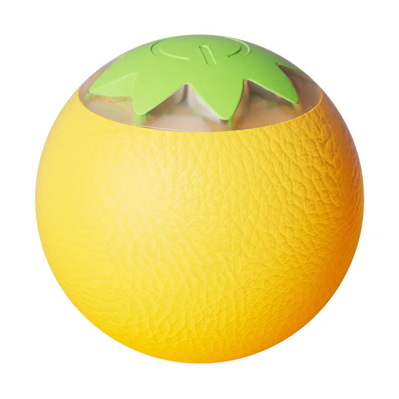 Green rolling ball electric pet toy for dogs and cats on indoor floor surface