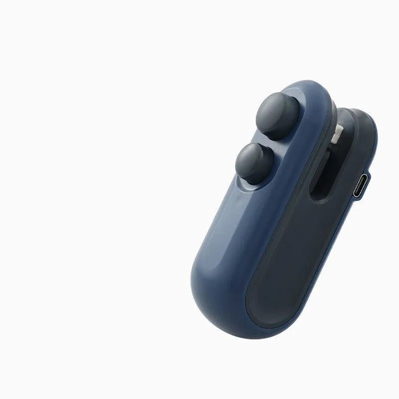 Blue and white handheld USB rechargeable heat sealer for sealing food storage bags on a kitchen counter.