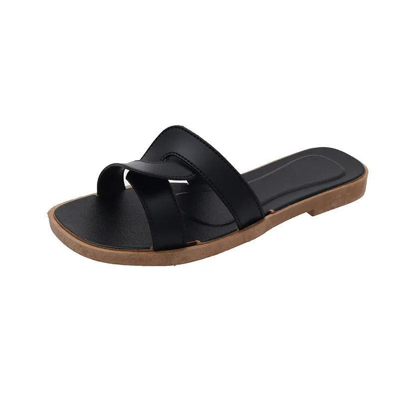 Women's solid-colour cross-strap PVC sandals with a toe-ring design on a non-slip sole.