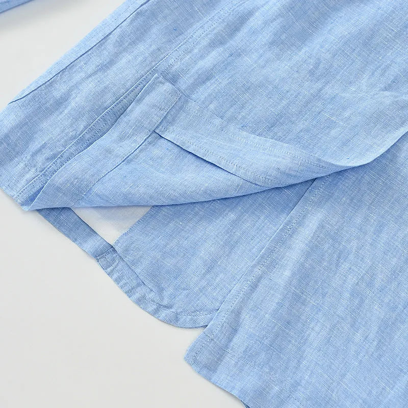 Men's thin solid-colour linen suit coat with notch lapel and chest pocket on a hanger.