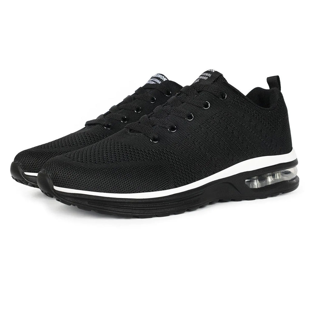 Pair of grey and black Flyknit mesh running shoes with a round toe and PU sole on a white background.