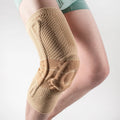 Black and blue adult sports knee pad for basketball and running protection.