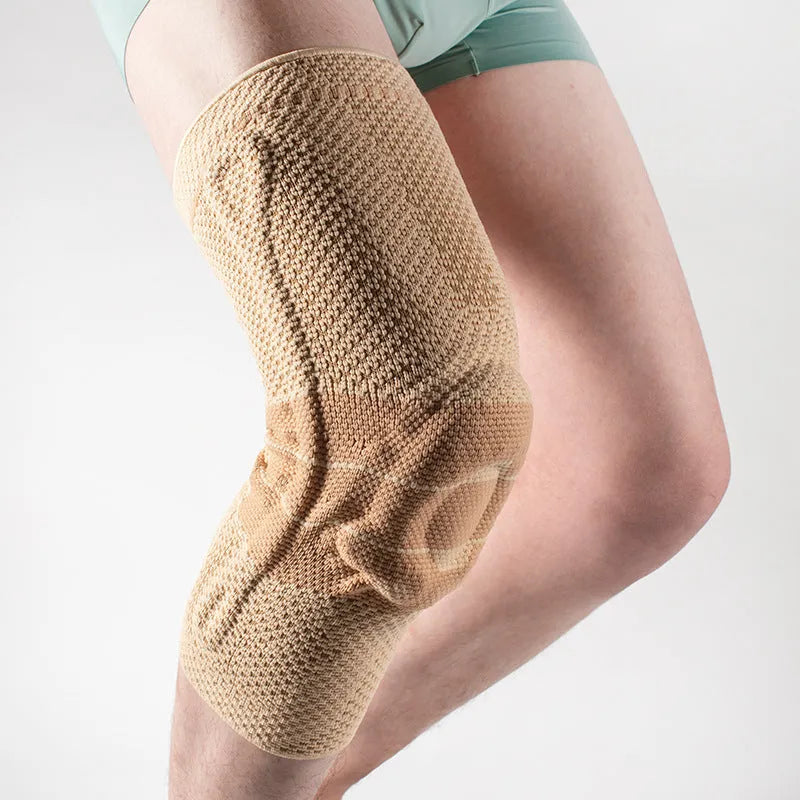 Black and blue adult sports knee pad for basketball and running protection.