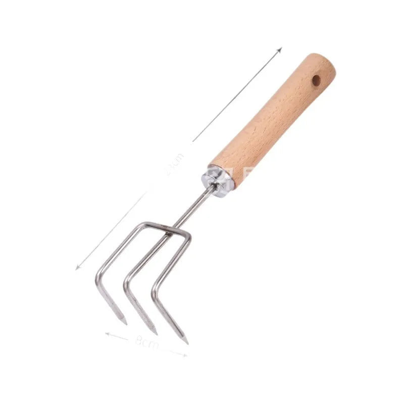 Gardening tools set with wooden handles and stainless steel hoe and shovel on rustic background