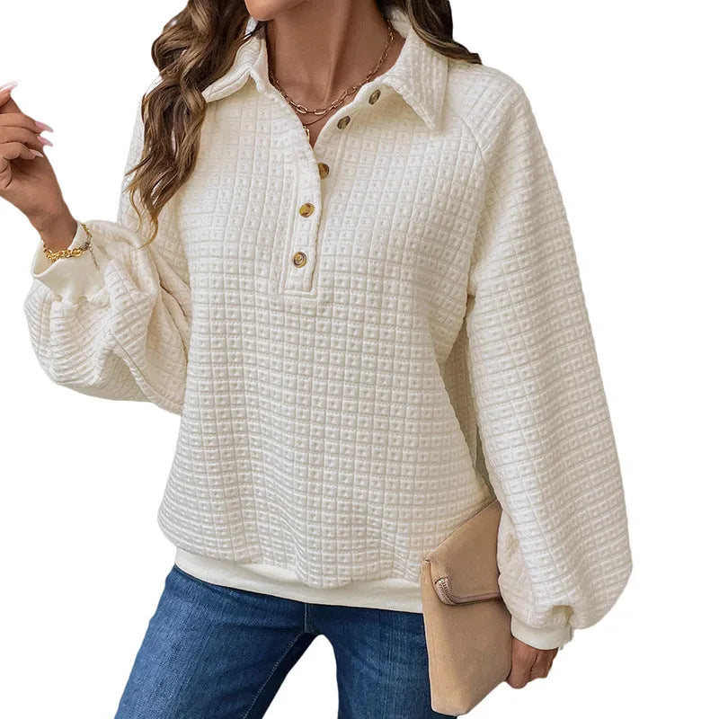 Women's milky white textured polo collar sweater on a hanger.