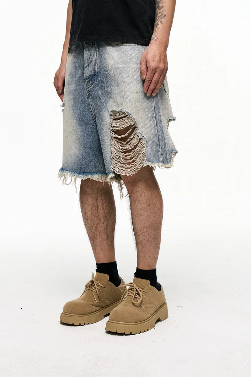 Men's light blue baggy denim shorts with wide leg cut and zip fly