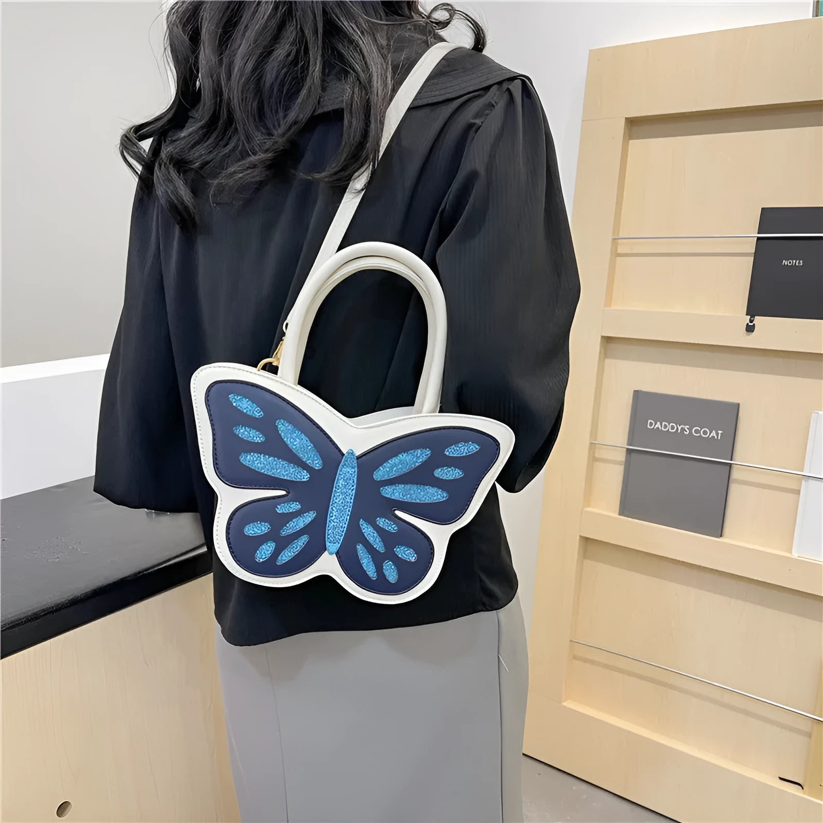 Women's square crossbody bag in PU leather with contrast detailing, shown in black, blue, pink, and white colour options