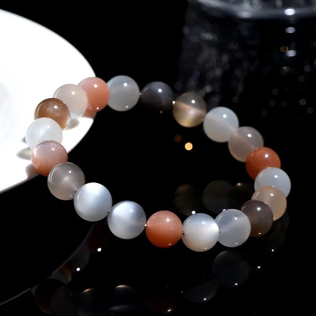 Natural moonstone Duobao bracelet with 8mm beads showcasing a colourful moonlight effect on an adjustable band.