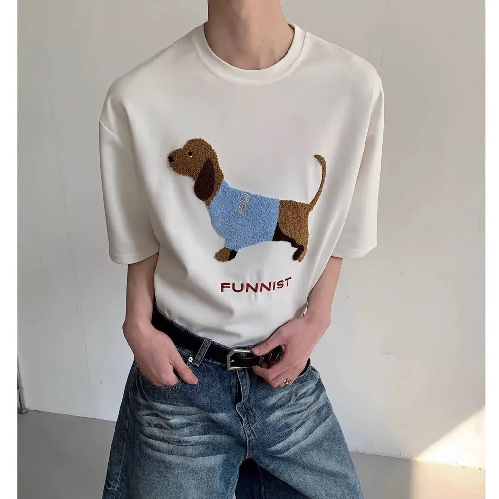 Men's grey cotton T-shirt with an embroidered sausage dog on the chest, showing short sleeves and a round neck.