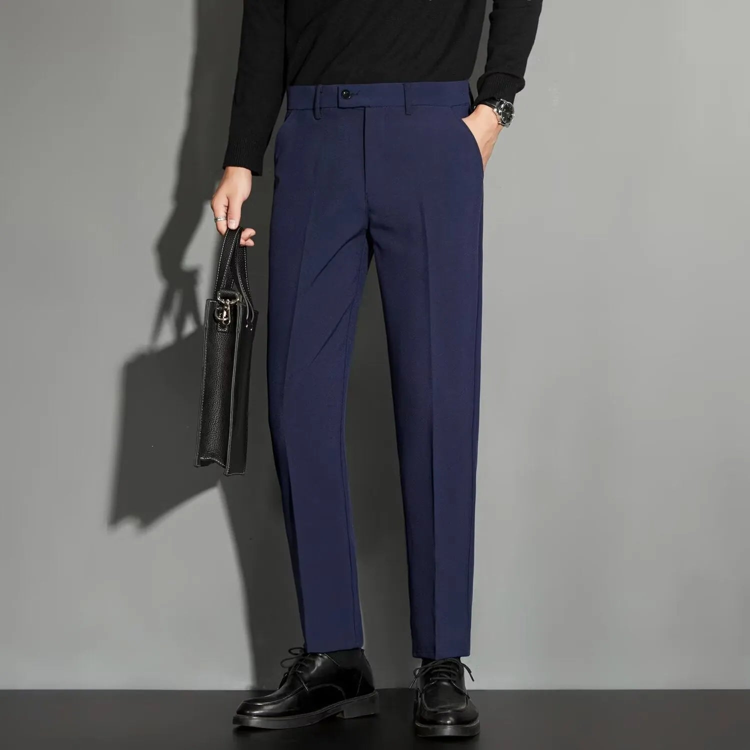 Men's straight-leg ankle-length suit trousers in apricot colour showing business gentleman styling with lightweight draping effect