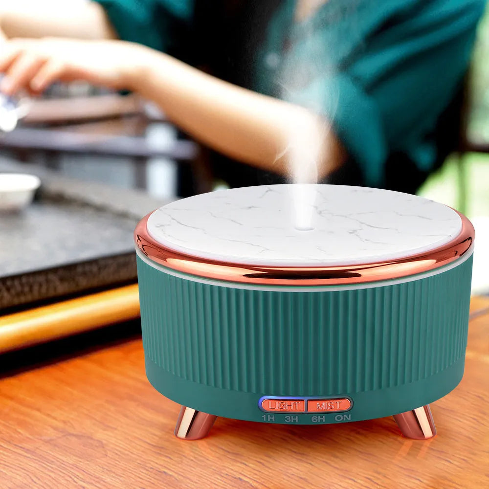 Round plastic ultrasonic aroma diffuser with wood grain finish and 500ml capacity, in green colour