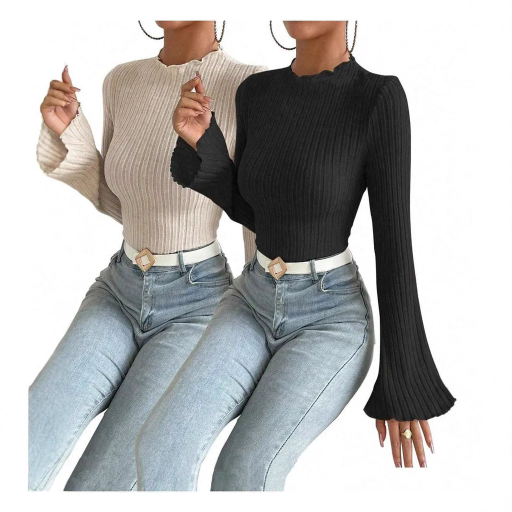 A black long sleeve slim fit top with round neck and lantern sleeves on a model.