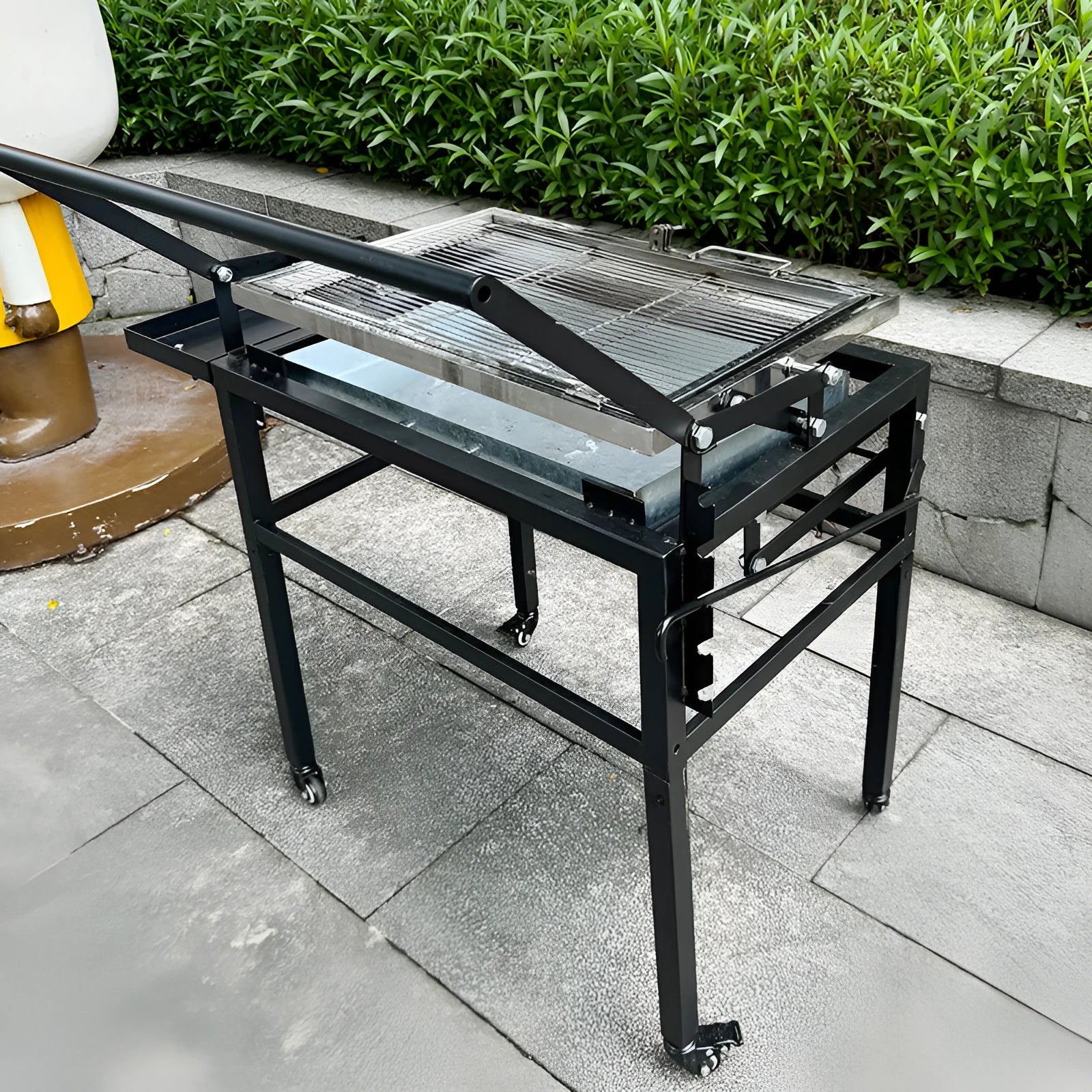 Flip BBQ large oven charcoal grill shown in a folded or detached state for portable storage.