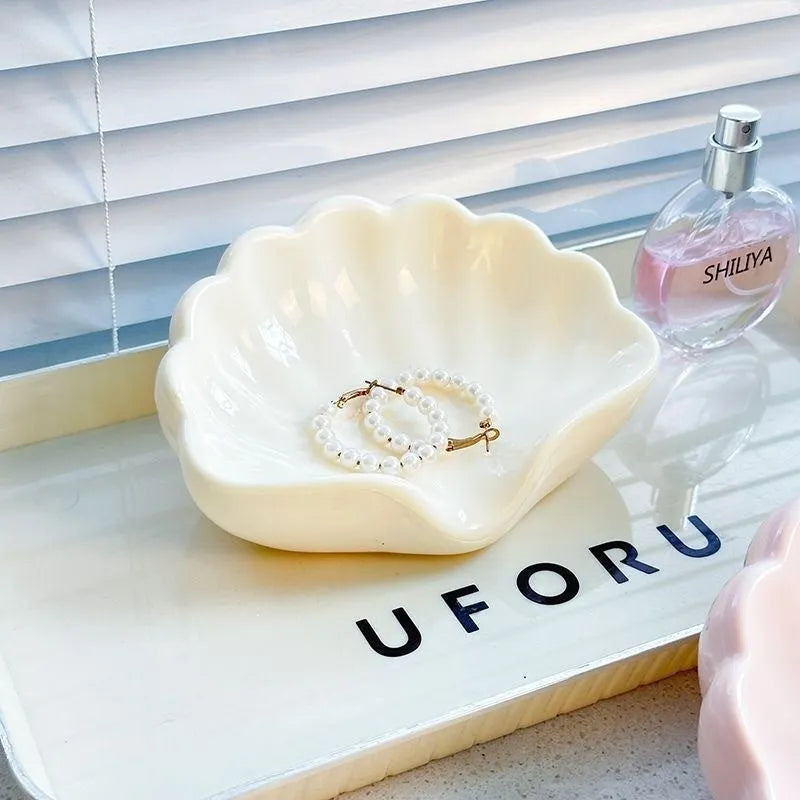 White shell-shaped plastic soap dish for bathroom countertops