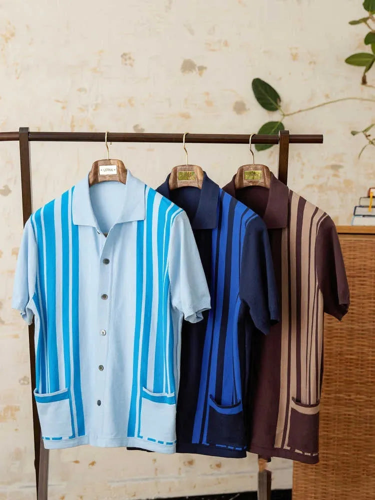 Light blue striped knitted cardigan polo shirt with lapel collar on a hanger.