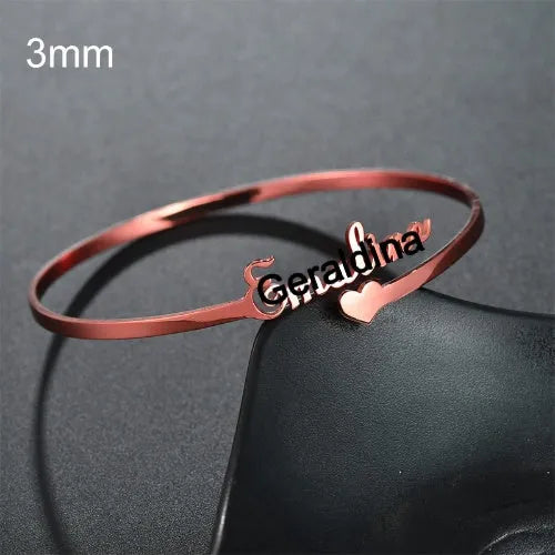 Personalised name bracelet in stainless steel with 10mm width, shown in silver, gold, or rose gold