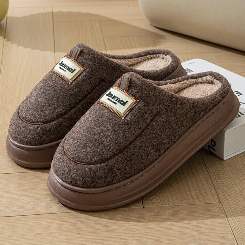 Men's grey suede slippers with thickened bottom and EVA sole showing extended sizing label